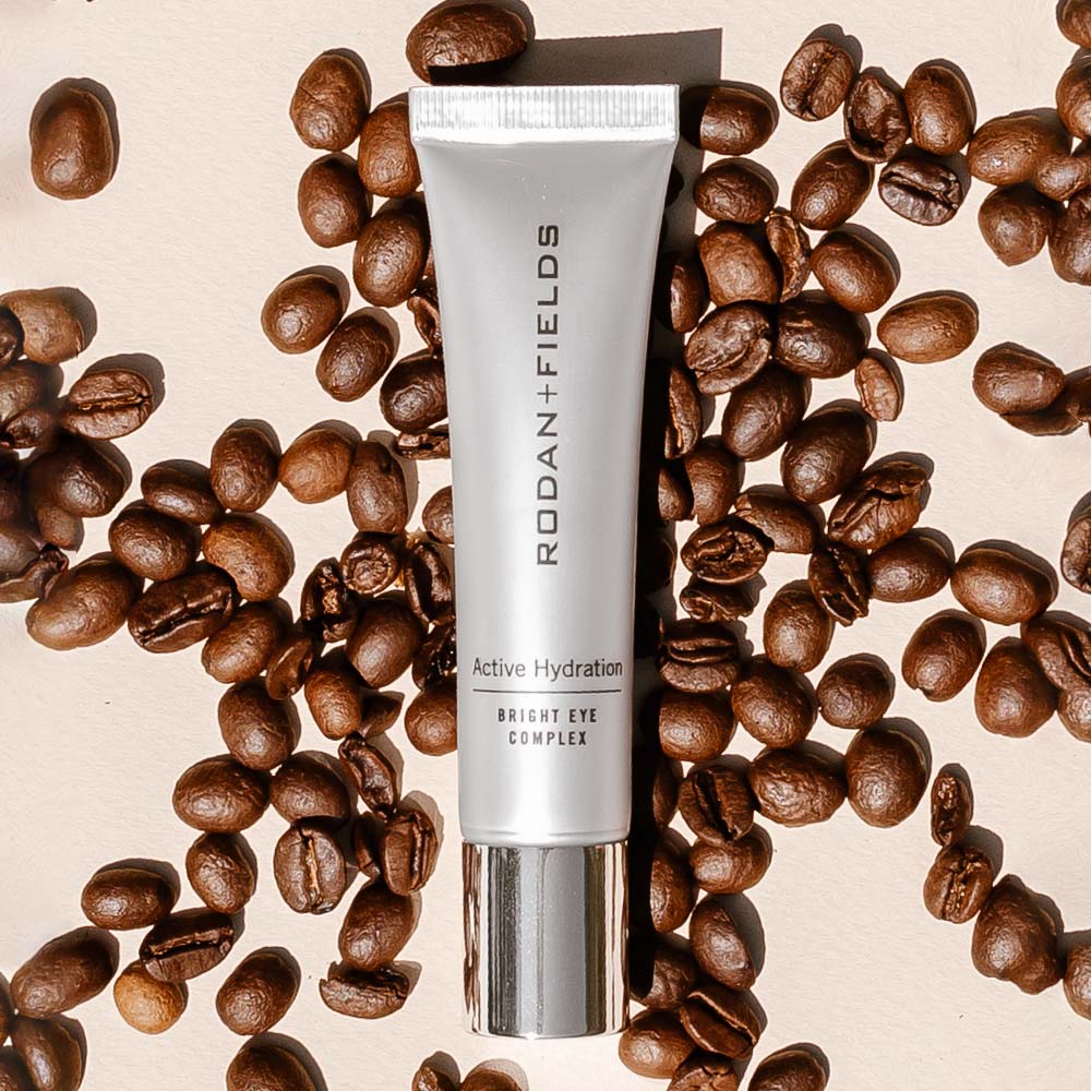 Rodan + Fields Active Hydration Bright Eye Complex pictured with coffee beans